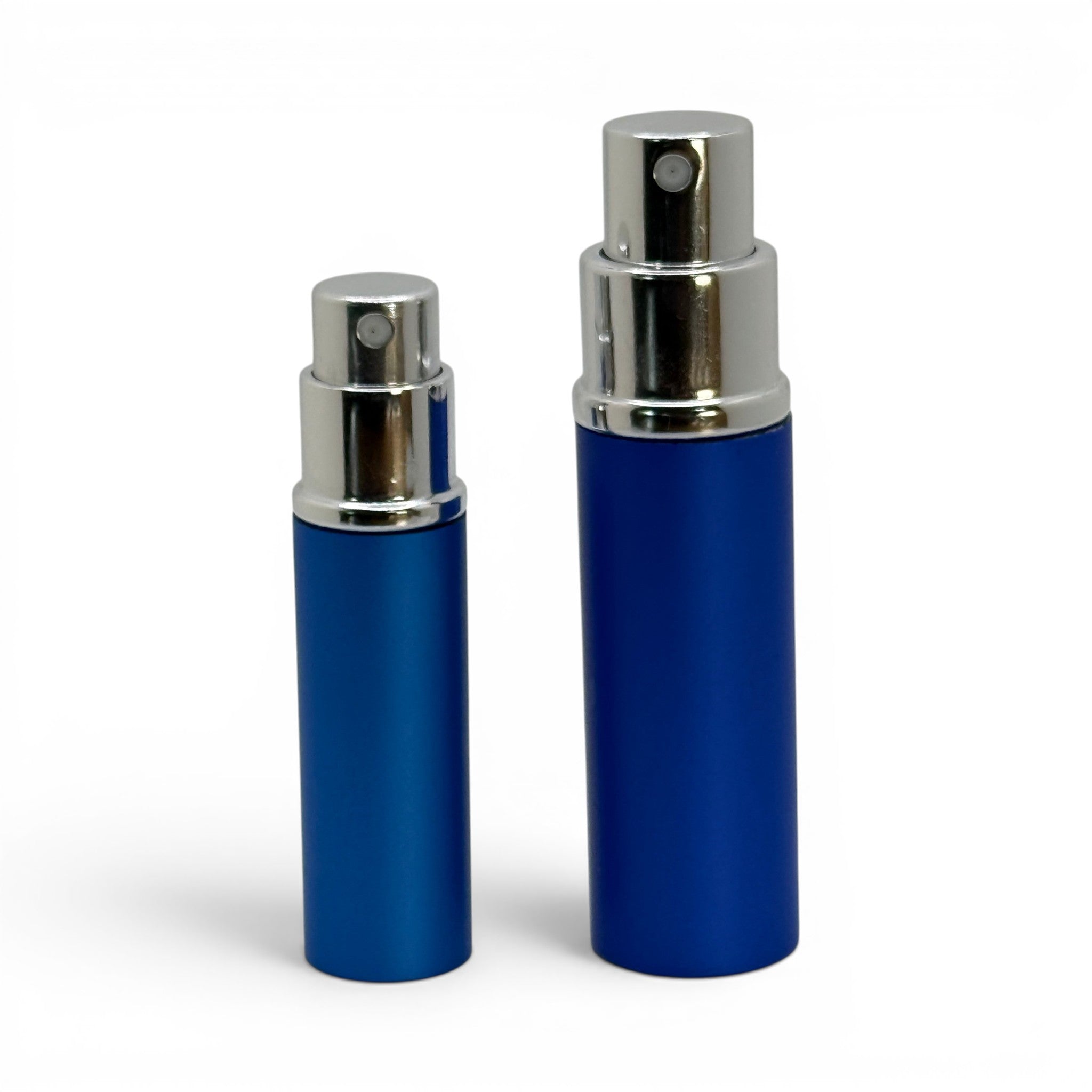 Metal travel sprayers with caps removed showing the sprayers