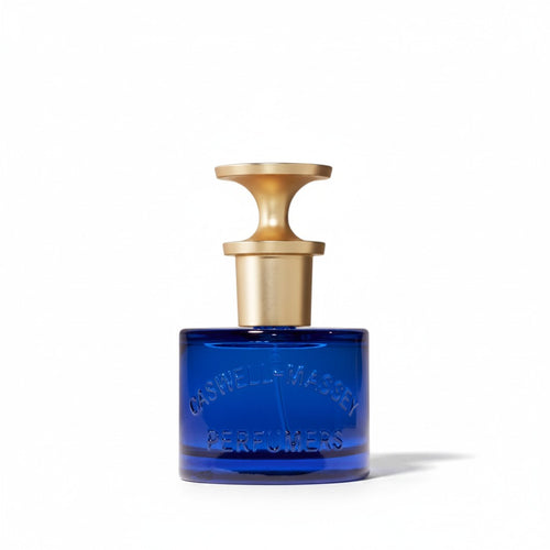 CRYOGEAR Caswell-Massey Heritage Elixir of Love perfume in a cobalt blue glass bottle with a gold stopper.