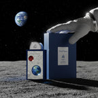 CRYOGEAR Lattafa Pride Art of Universe perfume bottle and box on the moon with an astronaut glove and Earth in view